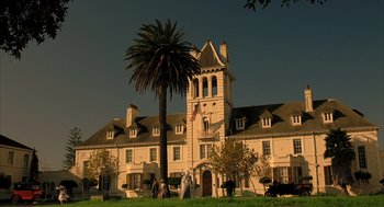 Movie still from “The Fall” (2006), directed by Tarsem Singh – A large building with a palm tree in front of it; Extreme Wide shot, Low angle