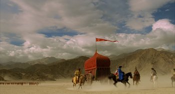 Movie still from “The Fall” (2006), directed by Tarsem Singh – A group of people riding horses in the desert; Extreme Wide shot, Low angle