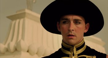Movie still from “The Fall” (2006), directed by Tarsem Singh – A person wearing a hat; Close Up shot, Low angle