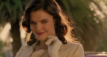 Movie still from “The Fall” (2006), directed by Tarsem Singh – A beautiful woman wearing gloves and a white dress; Close Up shot, Over the shoulder angle