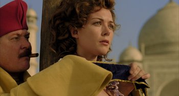 Movie still from “The Fall” (2006), directed by Tarsem Singh – A person wearing a yellow and blue outfit; Close Up shot, Low angle