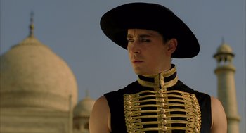 Movie still from “The Fall” (2006), directed by Tarsem Singh – A man in a black hat is wearing a black hat; Close Up shot, Low angle