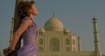 Movie still from “The Fall” (2006), directed by Tarsem Singh – A woman standing in front of a large building; Medium shot, Low angle