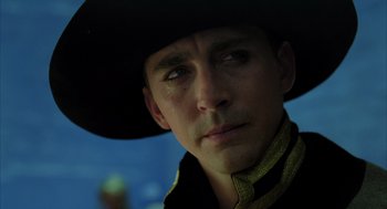 Movie still from “The Fall” (2006), directed by Tarsem Singh – A person wearing a cowboy hat; Close Up shot, Low angle