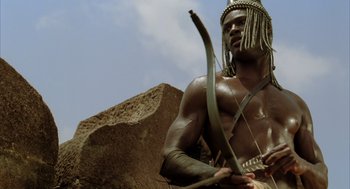 Movie still from “The Fall” (2006), directed by Tarsem Singh – A man with a bow and arrow in his hands; Close Up shot, Low angle