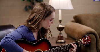 Movie still from “A Cowgirl's Song” (2022), directed by Timothy Armstrong – Medium shot, Over the shoulder angle