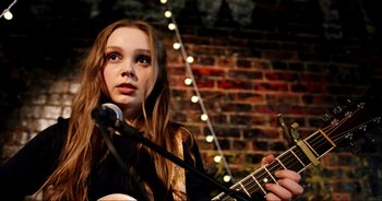 Movie still from “A Cowgirl's Song” (2022), directed by Timothy Armstrong – Close Up shot, Over the shoulder angle