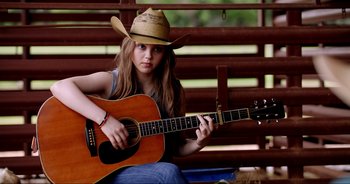 Movie still from “A Cowgirl's Song” (2022), directed by Timothy Armstrong – Medium shot, Over the shoulder angle