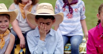 Movie still from “A Cowgirl's Song” (2022), directed by Timothy Armstrong – Close Up shot, Over the shoulder angle