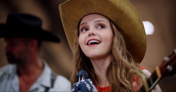 Movie still from “A Cowgirl's Song” (2022), directed by Timothy Armstrong – Close Up shot, Low angle