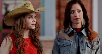 Movie still from “A Cowgirl's Song” (2022), directed by Timothy Armstrong – Close Up shot, Over the shoulder angle