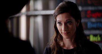 Movie still from “A Cowgirl's Song” (2022), directed by Timothy Armstrong – A person with long hair; Close Up shot, Over the shoulder angle