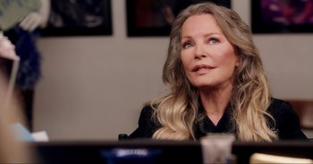 Movie still from “A Cowgirl's Song” (2022), directed by Timothy Armstrong – An older woman sitting in front of a computer monitor; Close Up shot, Over the shoulder angle