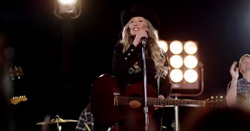 Movie still from “A Cowgirl's Song” (2022), directed by Timothy Armstrong – Medium shot, Low angle