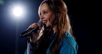 Movie still from “A Cowgirl's Song” (2022), directed by Timothy Armstrong – Close Up shot, Over the shoulder angle