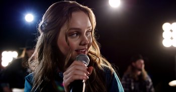 Movie still from “A Cowgirl's Song” (2022), directed by Timothy Armstrong – Close Up shot, Over the shoulder angle