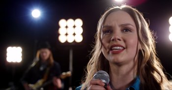 Movie still from “A Cowgirl's Song” (2022), directed by Timothy Armstrong – Close Up shot, Over the shoulder angle