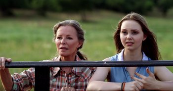 Movie still from “A Cowgirl's Song” (2022), directed by Timothy Armstrong – Close Up shot, Over the shoulder angle