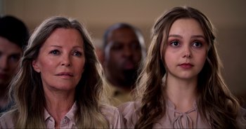 Movie still from “A Cowgirl's Song” (2022), directed by Timothy Armstrong – Two women standing next to each other in front of a man; Close Up shot, Over the shoulder angle