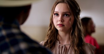 Movie still from “A Cowgirl's Song” (2022), directed by Timothy Armstrong – Close Up shot, Over the shoulder angle