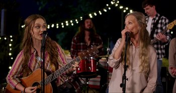 Movie still from “A Cowgirl's Song” (2022), directed by Timothy Armstrong – Medium shot, Over the shoulder angle