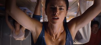 Movie still from “A Deadly Invitation” (2023), directed by J.M Cravioto – A person with their arms up; Close Up shot, Low angle