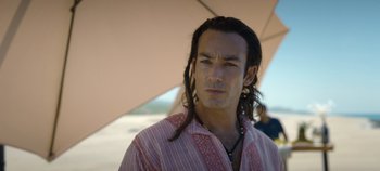 Movie still from “A Deadly Invitation” (2023), directed by J.M Cravioto – A person with long hair; Close Up shot, Low angle