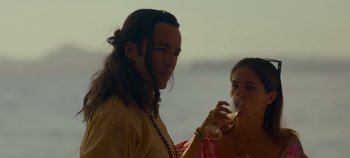 Movie still from “A Deadly Invitation” (2023), directed by J.M Cravioto – A man and a woman are drinking wine together; Close Up shot, Over the shoulder angle