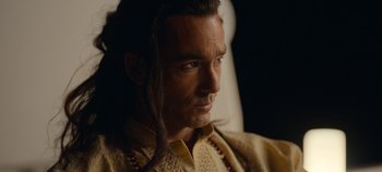 Movie still from “A Deadly Invitation” (2023), directed by J.M Cravioto – A person with long hair; Close Up shot, Over the shoulder angle