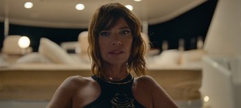 Movie still from “A Deadly Invitation” (2023), directed by J.M Cravioto – A person wearing a necklace; Close Up shot, Low angle