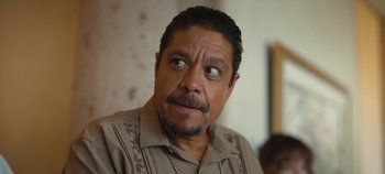 Movie still from “A Deadly Invitation” (2023), directed by J.M Cravioto – A person wearing a shirt; Close Up shot, Over the shoulder angle