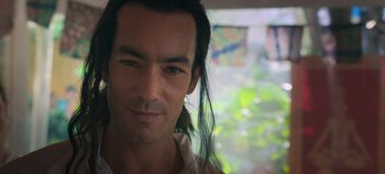 Movie still from “A Deadly Invitation” (2023), directed by J.M Cravioto – A person with long black hair; Close Up shot, Low angle