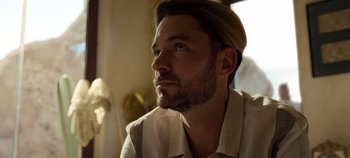 Movie still from “A Deadly Invitation” (2023), directed by J.M Cravioto – A person with a beard; Close Up shot, Low angle