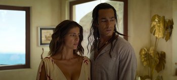 Movie still from “A Deadly Invitation” (2023), directed by J.M Cravioto – A man and a woman standing next to each other; Close Up shot, Low angle