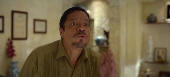 Movie still from “A Deadly Invitation” (2023), directed by J.M Cravioto – A person wearing a shirt; Close Up shot, Over the shoulder angle