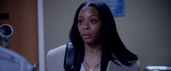 Movie still from “A Fall from Grace” (2020), directed by Tyler Perry – A woman that is holding a phone in her hand; Close Up shot, Over the shoulder angle