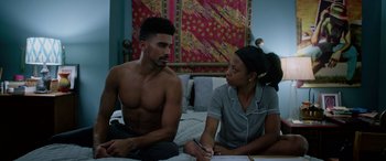 Movie still from “A Fall from Grace” (2020), directed by Tyler Perry – A man and a woman sitting on a bed talking to each other; Medium shot, Over the shoulder angle