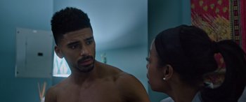 Movie still from “A Fall from Grace” (2020), directed by Tyler Perry – A man and a woman looking at each other in a mirror; Close Up shot, Over the shoulder angle