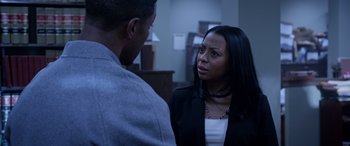 Movie still from “A Fall from Grace” (2020), directed by Tyler Perry – A woman in a black jacket talking to a man in a white shirt; Close Up shot, Over the shoulder angle