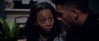 Movie still from “A Fall from Grace” (2020), directed by Tyler Perry – A woman and a man looking at one another; Close Up shot, Over the shoulder angle