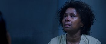 Movie still from “A Fall from Grace” (2020), directed by Tyler Perry – An older woman looking up at the ceiling; Close Up shot, Over the shoulder angle