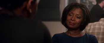 Movie still from “A Fall from Grace” (2020), directed by Tyler Perry – A woman sitting in front of another woman in front of a window; Close Up shot, Over the shoulder angle
