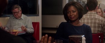 Movie still from “A Fall from Grace” (2020), directed by Tyler Perry – A woman sitting at a table in front of a man; Close Up shot, Over the shoulder angle
