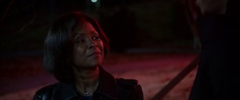 Movie still from “A Fall from Grace” (2020), directed by Tyler Perry – A woman in a black jacket looking up at the sky; Close Up shot, Over the shoulder angle