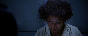 Movie still from “A Fall from Grace” (2020), directed by Tyler Perry – A person looking at the camera; Close Up shot, Over the shoulder angle