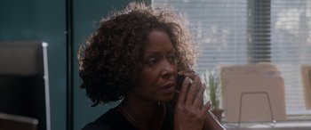 Movie still from “A Fall from Grace” (2020), directed by Tyler Perry – A person talking on a cell phone; Close Up shot, High angle