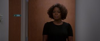 Movie still from “A Fall from Grace” (2020), directed by Tyler Perry – A woman in a black shirt is looking at the camera; Close Up shot, Over the shoulder angle
