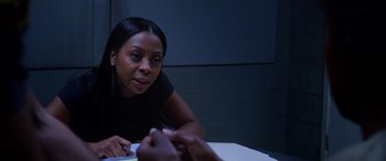 Movie still from “A Fall from Grace” (2020), directed by Tyler Perry – A woman sitting at a table in front of a person; Close Up shot, Over the shoulder angle