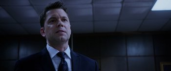 Movie still from “A Fall from Grace” (2020), directed by Tyler Perry – A man in a suit and a tie; Close Up shot, Low angle