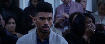 Movie still from “A Fall from Grace” (2020), directed by Tyler Perry – A person wearing a jacket; Close Up shot, Over the shoulder angle